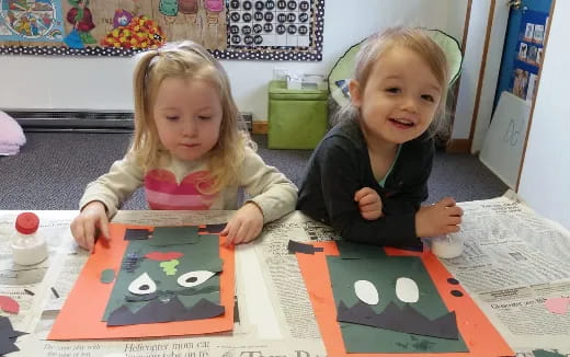 two children sitting at a table