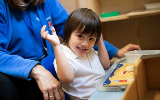 a child smiling at the camera