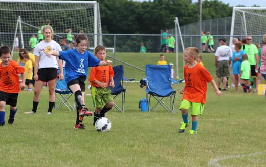 kids playing football on a field