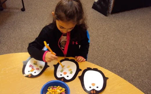 a child painting on a table