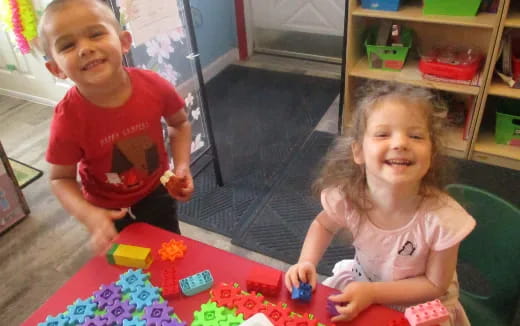 a couple of children playing with toys