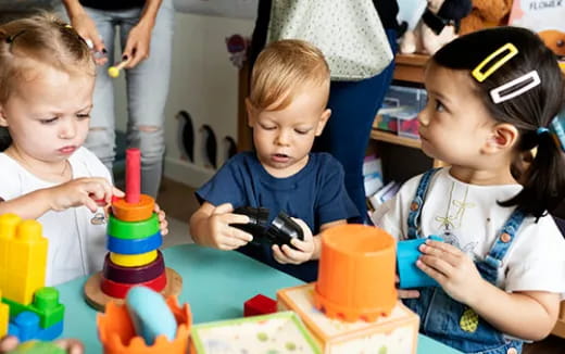 a group of children playing with toys