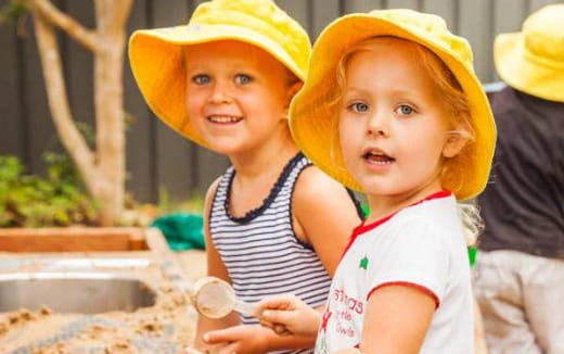 a couple of children wearing hats