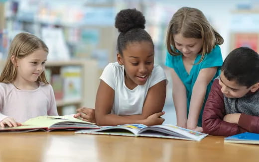 a group of children studying