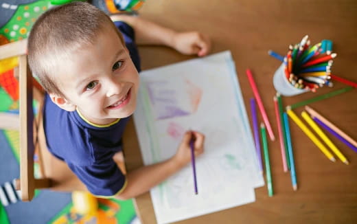 a child sitting at a table