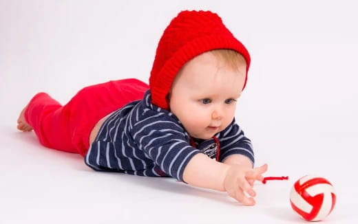 a baby wearing a santa hat