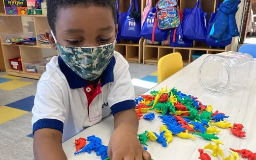 a child painting with a brush