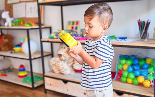 a child holding a toy