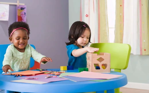 a couple of children playing with toys