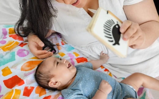 a woman holding a baby