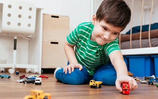 a boy playing with toys