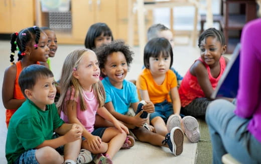 a group of children sitting on the floor