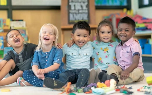 a group of children sitting on the floor