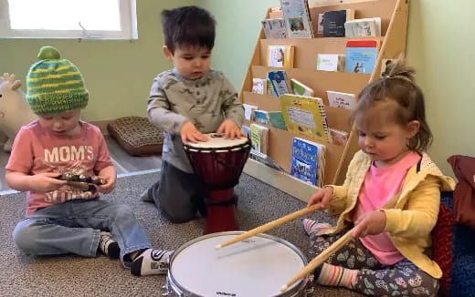 children playing with a drum