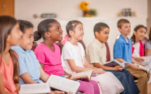 a group of students sitting in a classroom