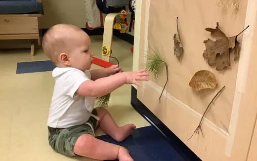 a baby playing with a toy