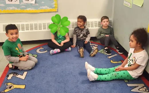 a group of children sitting on the floor