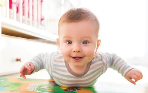 a baby crawling on a table