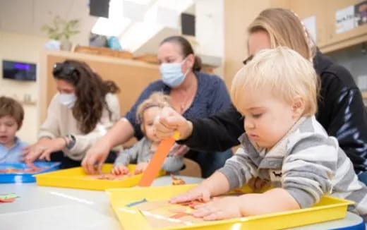 a group of children wearing masks