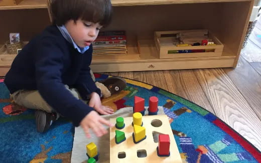 a boy playing with toys