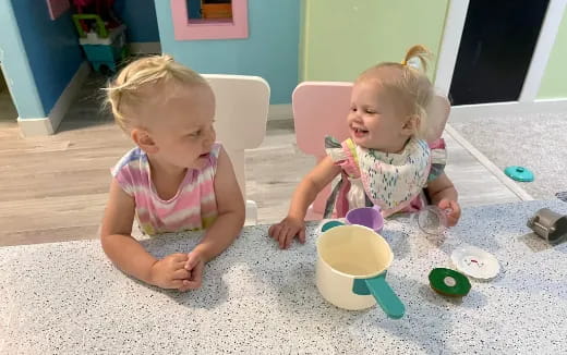 two children sitting on the floor