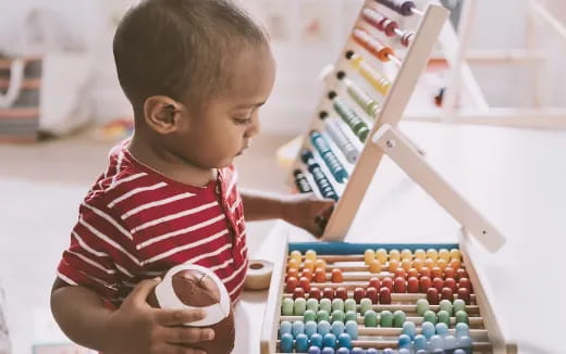 a baby playing with a toy