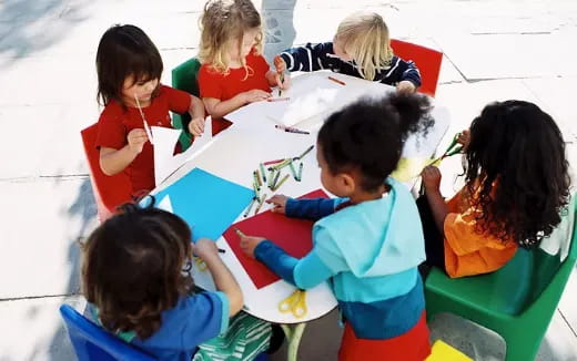 a group of children painting