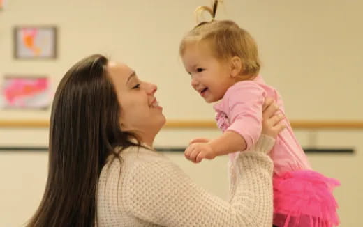 a person holding a baby