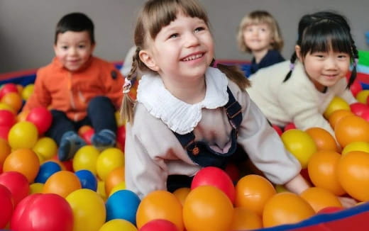 a group of children in a ball pit