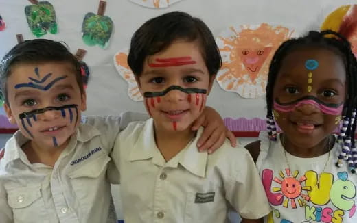 a group of children with face paint