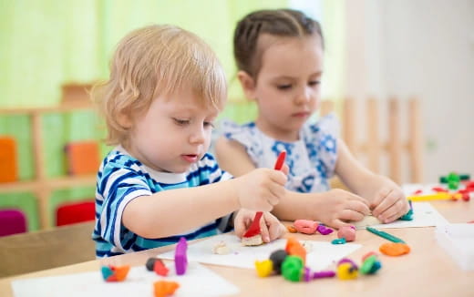 a couple of kids playing with toys