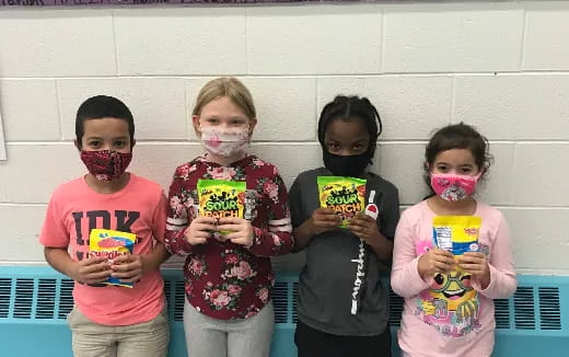 a group of kids with face paint