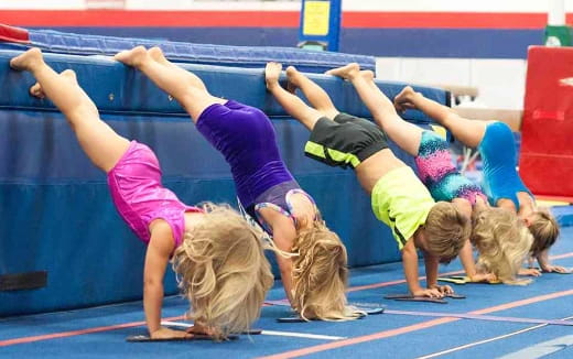 a group of women doing a yoga move