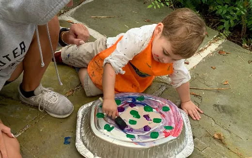 a baby playing with a toy