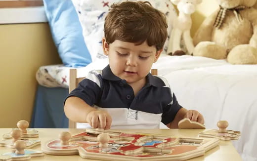 a boy sitting at a table