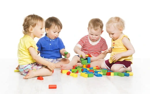 a group of children playing with toys