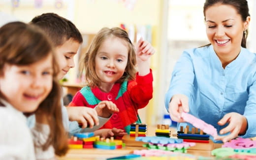 a group of children playing with toys