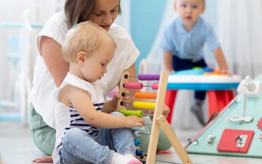 a person and a child playing with toys