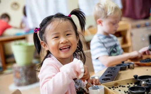 a young girl smiling