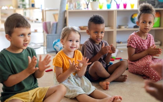 a group of children sitting on the floor