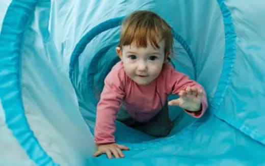 a baby in a tunnel
