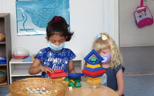 a couple of children playing with toys