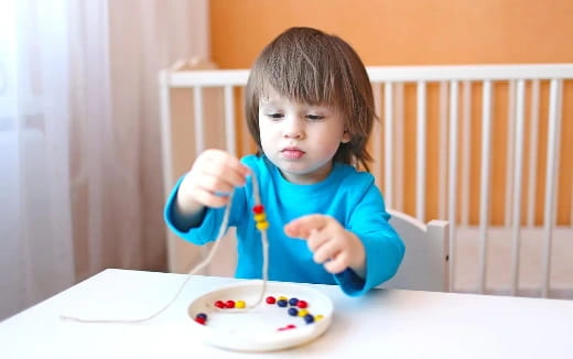 a child holding a spoon