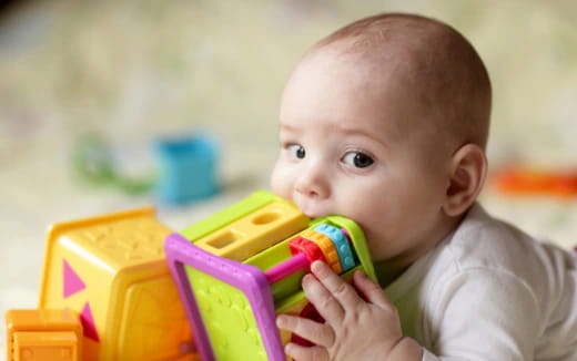 a baby playing with a toy