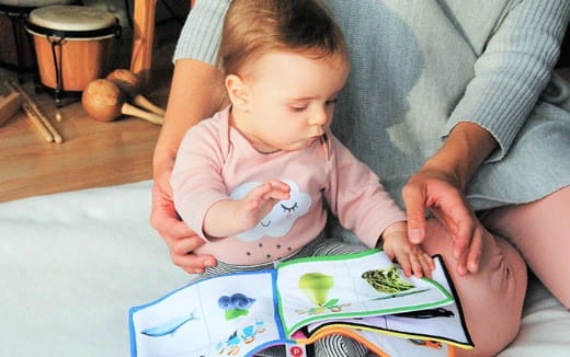 a baby looking at a book