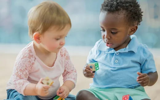 a couple of children playing with toys