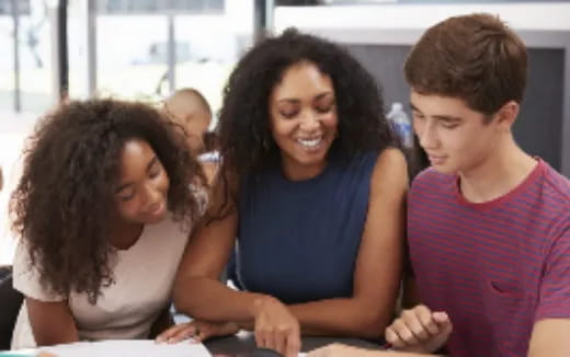 a group of people sitting at a table