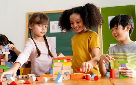 a group of children playing with blocks