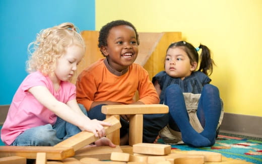 a group of children sitting on the floor