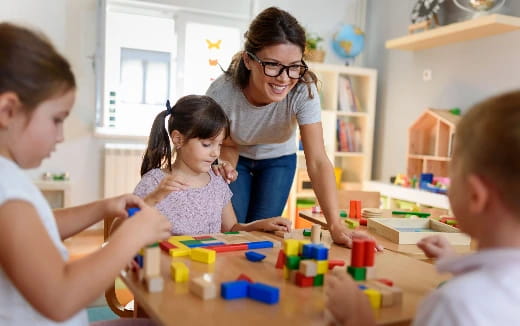 a person and children playing with toys